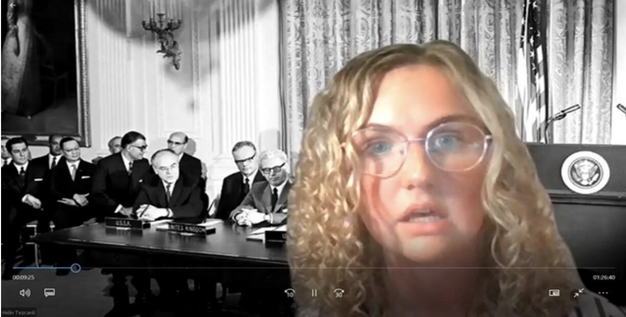 Student performing a space-law piece over Zoom, composited against archival footage of a treaty signing