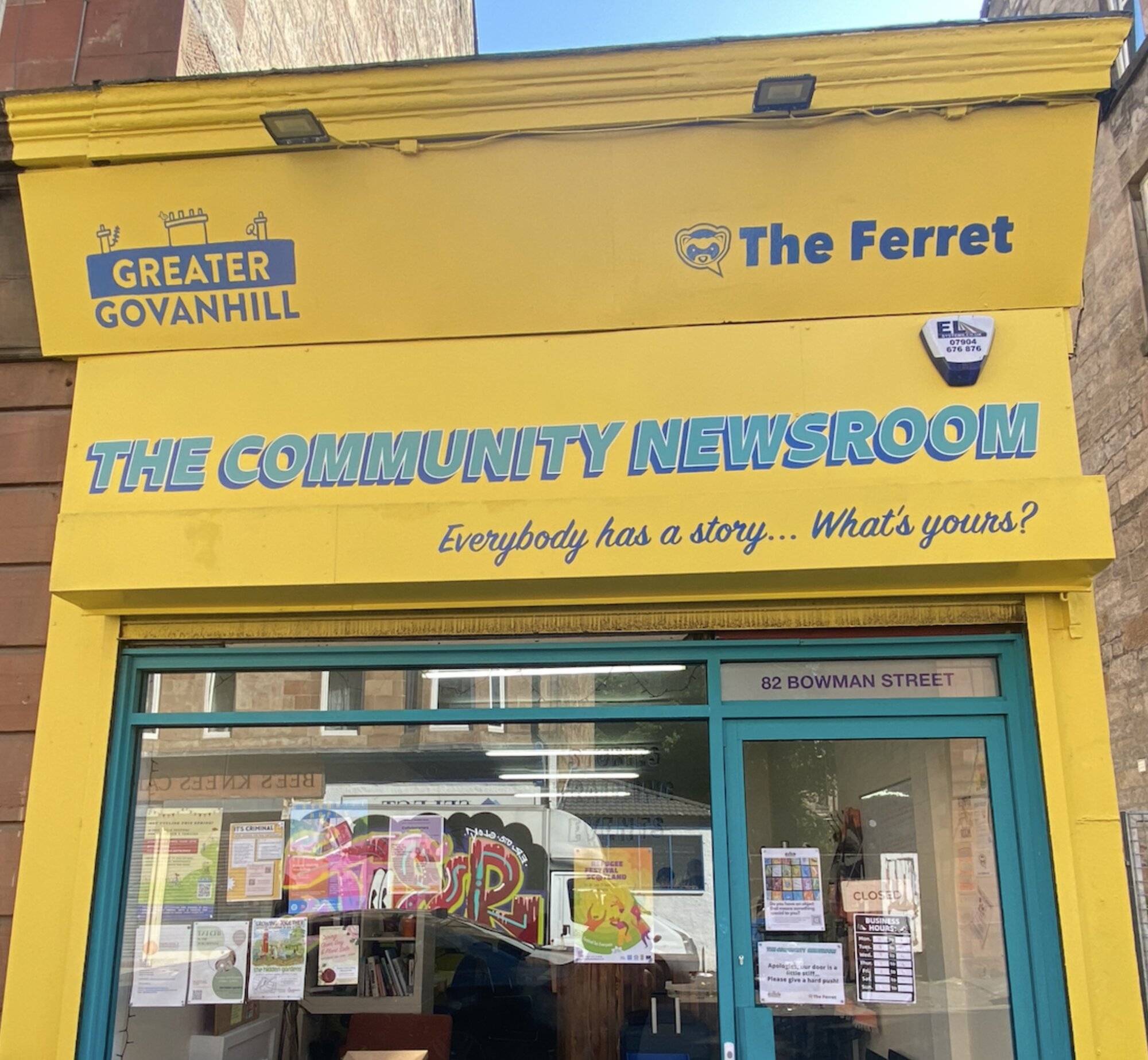 Bright yellow shopfront of The Community Newsroom run by Greater Govanhill and The Ferret